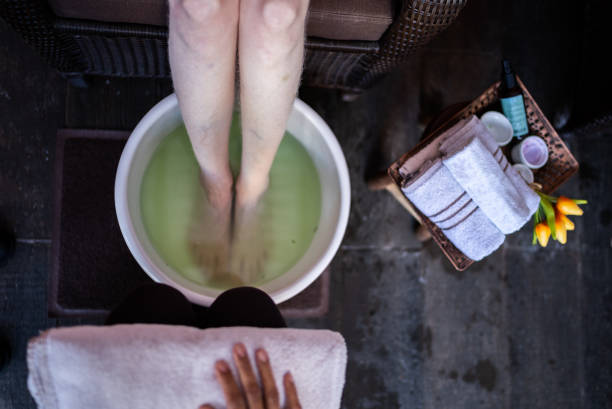 Woman's foot in a foot bath at a beauty spa