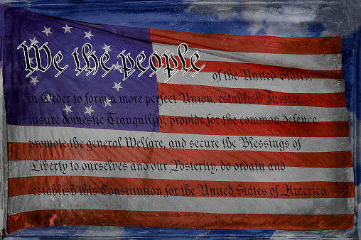 US Constitution with Betsy Ross 13-star Flag and Blue Sky Background