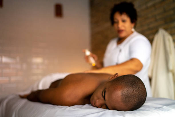 istock Young man receiving massage at a beauty spa 1411434307