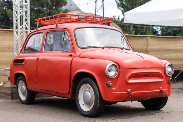 Vintage red tiny car in a parking