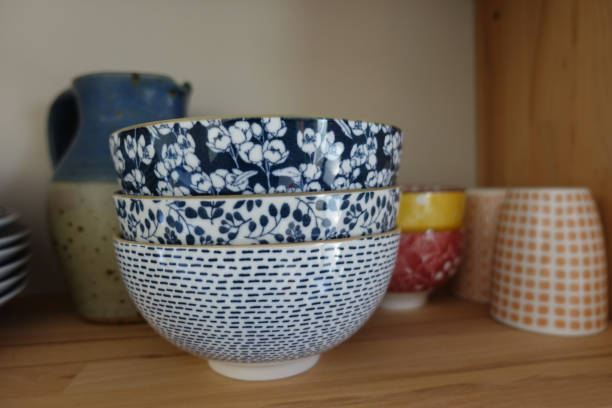 istock Decorated ceramic Bowls Pitcher coffee cups placed on a buffet shelf 1411436023