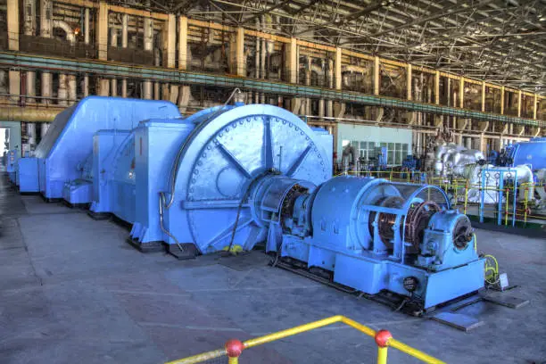 Photo of CHP. Huge production of heat generation for the population. Heat electro center. Large-scale enterprise with wires and turbines.