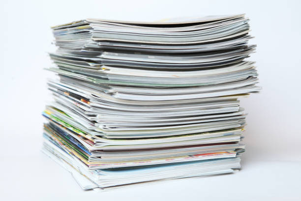 istock A large stack of printing magazines on a white background. Lots of different publications. 1411437656
