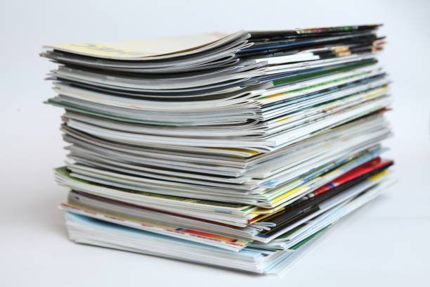 istock A large stack of printing magazines on a white background. Lots of different publications. 1411437682