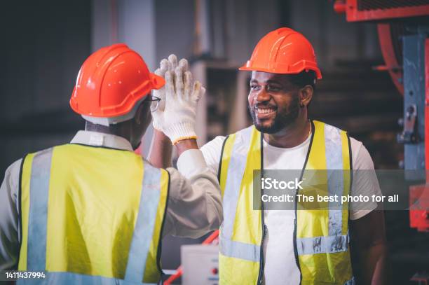 Teamwork African American Worker In The Factory Black Man Afro Work Heavy Industrial Stock Photo - Download Image Now