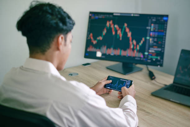 istock Asian man focus to his phone 1411439103