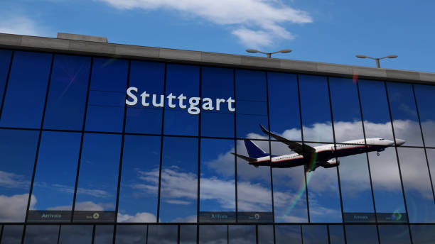 istock Airplane landing at Stuttgart Germany airport mirrored in terminal 1411442737