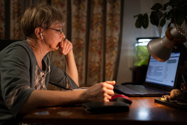 istock Remote work during pandemic. Concentrated mature women working from home. 1411444021
