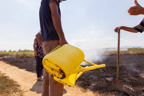 istock Unrecognizable farmer man holding yellow plastic bucket 1411445951