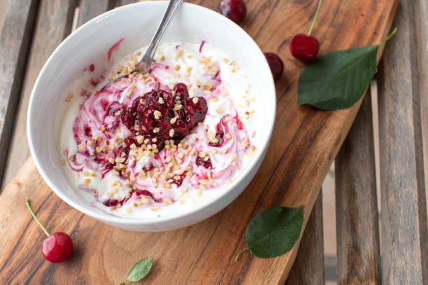 Protein breakfast bowl with greek yogurt, fruits and nuts stock photo