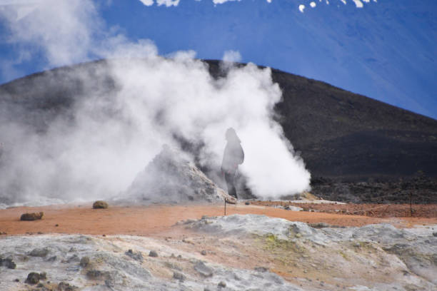 istock Smoke from a fumarole enveloping a tourist 1411447333