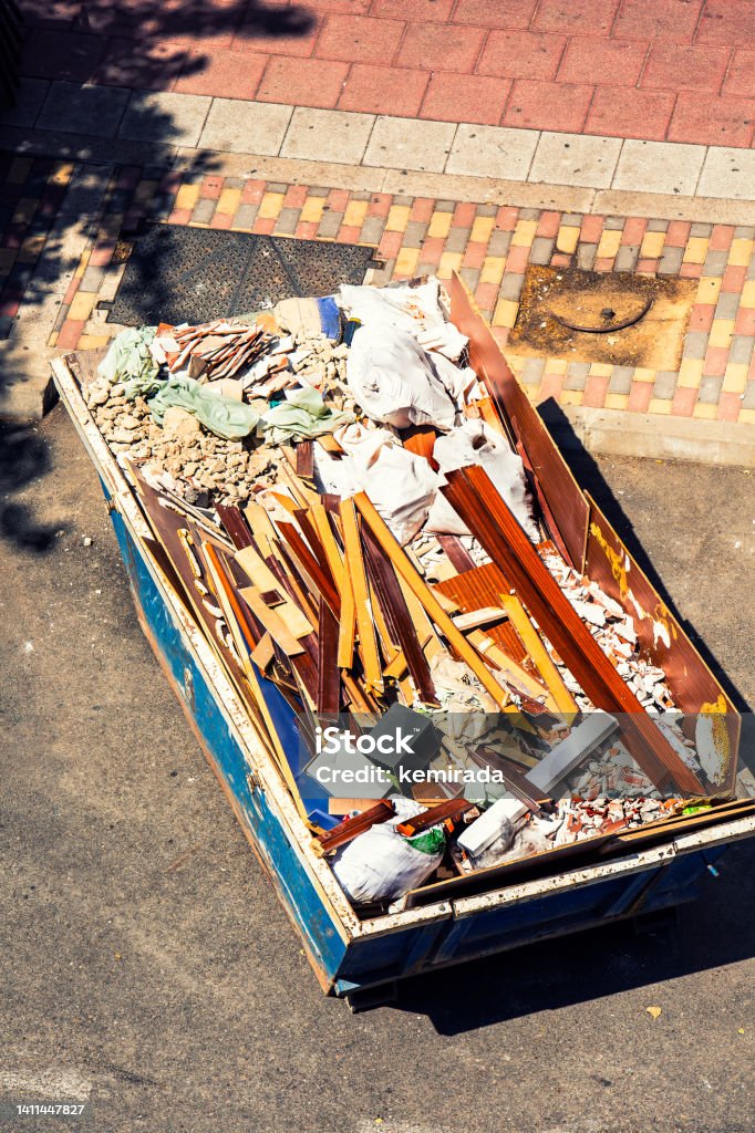 top view of debris container full of material from a house renovation steel container with construction waste Garbage Stock Photo
