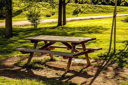 green landscape with picnic tables in the countryside