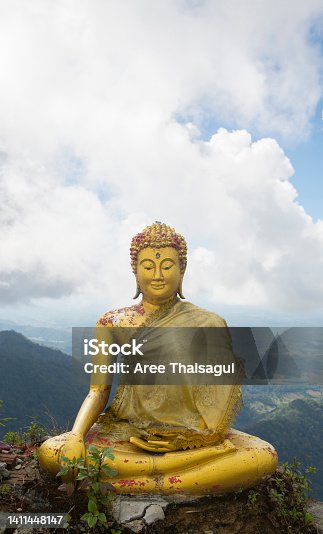 istock Golden Buddha in the mountains. 1411448147