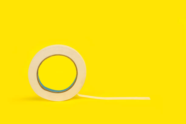 istock A paper masking tape on a yellow background with copy space 1411449329