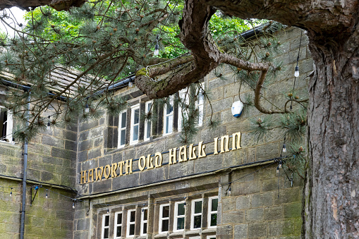 This is historic Haworth, Yorkshire, England, UK, home of the Bronte sisters.  This image is of the Haworth Old Hall Inn, a pub near the bottom of the high street.