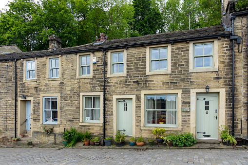 This is historic Haworth, Yorkshire, England, UK, home of the Bronte sisters.  This is a set of near identical row houses on the High Street.