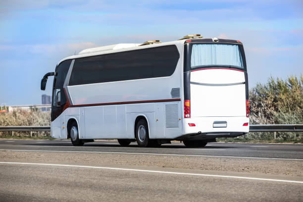 istock bus moves along suburban highway 1411455382