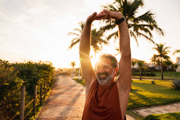 istock Active senior man stretching outside, preparing for a run. 1411457815