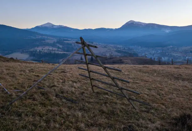 Photo of Late autumn mountain countyside sunset scene. Picturesque traveling, seasonal, nature and countryside beauty concept scene. Carpathians, Ukraine.