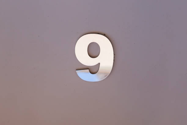 istock 9 metal number with copy space and gray tone - nine 1411460796