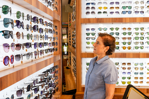 Choosing glasses in a eyewear store