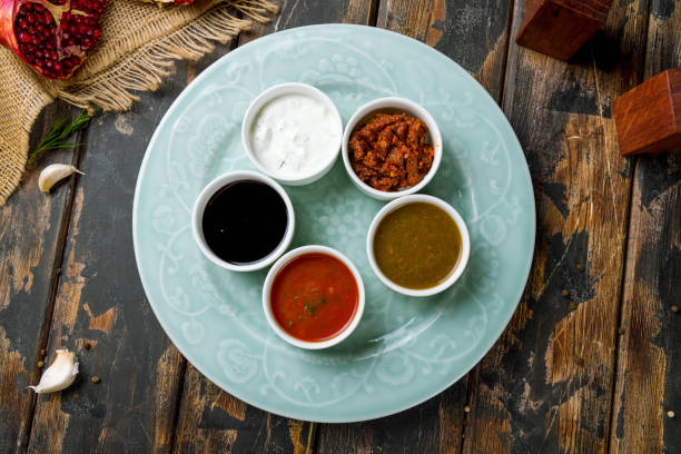 assorted sauces top view on old wooden table
