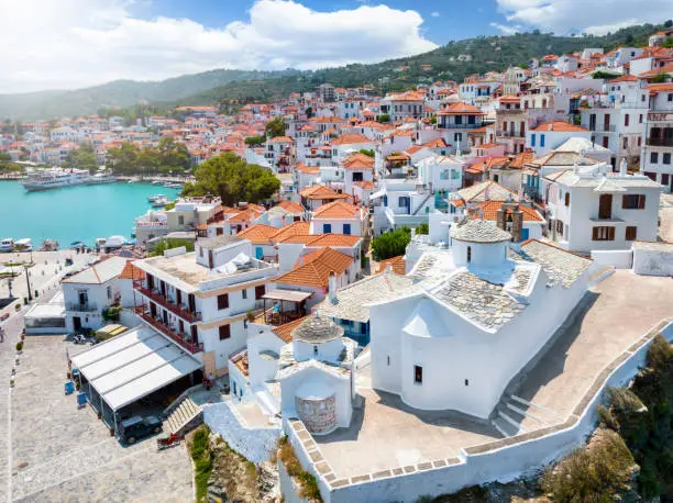 Aerial view of Skopelos island town with the Church of the Virgin Mary in front, Sporades, Greece