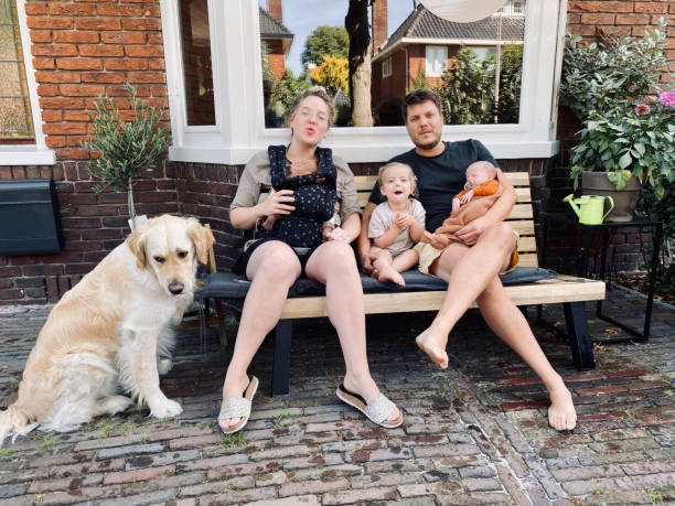 istock Young family with just born twin 1411472592
