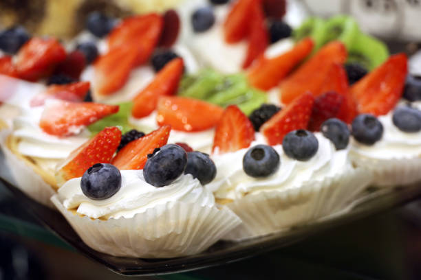 Sweet cream dessert with blueberries, kiwi, strawberry and blackberries