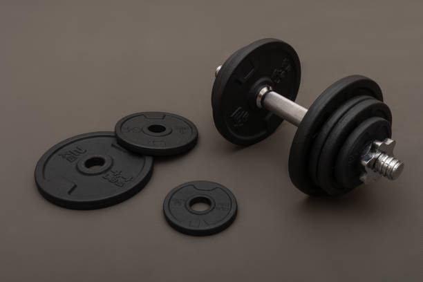 istock Weight training dumbbell kit with some cast iron weight plates 1411474800