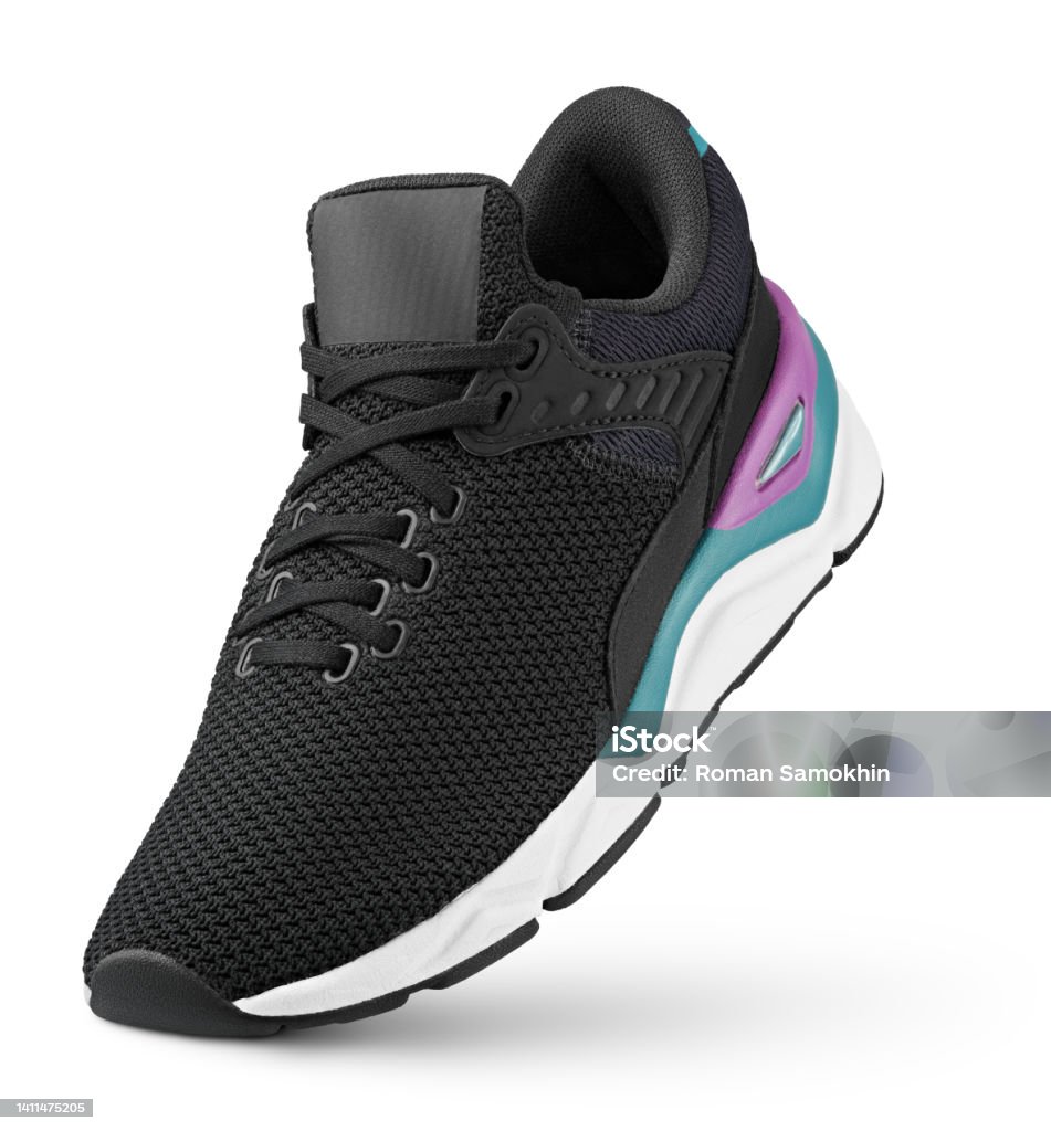 Black sneaker stands on the tip isolated on white Black sneaker stands on the tip isolated on white background. Running sports shoe with clipping path. Full Depth of Field Sports Shoe Stock Photo