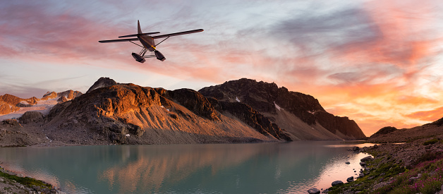 Seaplane Flying over the Glacier Lake and Mountains Landscape at sunset. Adventure Composite. 3D Rendering Airplane. Background Image from Whistler, British Columbia, Canada.