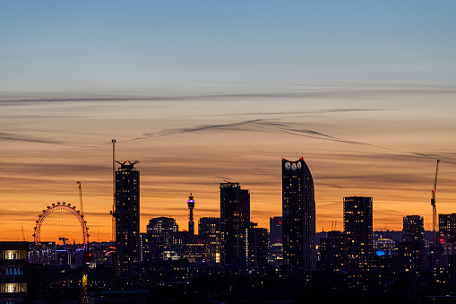 A scenic skyline view of the Elephant and Castle area, London Eye and BT Tower in the background at the sunset as seen from the South-East
