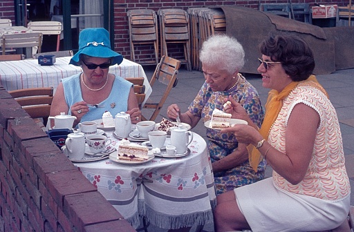 The Netherlands (unfortunately the exact location is unknown), 1968. Three elderly women having coffee and cake on a cafe terrace.