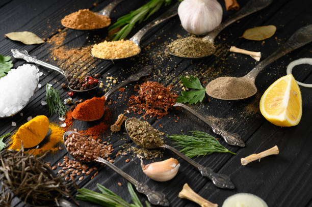 istock Colorful various herbs and spices for cooking on dark wooden rustic background 1411485449