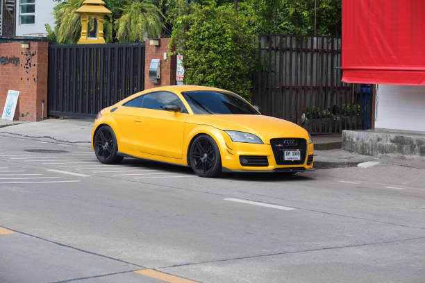 Yellow Audi TT coupe parked in Bangkok Nawamin