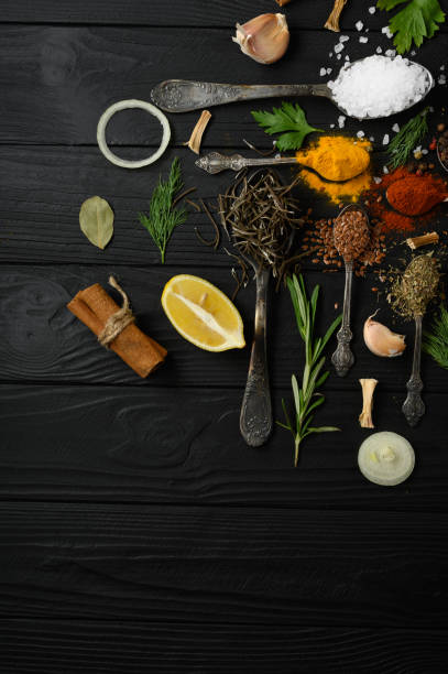 istock Colorful various herbs and spices for cooking on dark wooden rustic background 1411486270