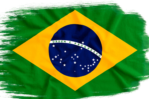 Flag of Brazil is depicted in paint style isolated on white.