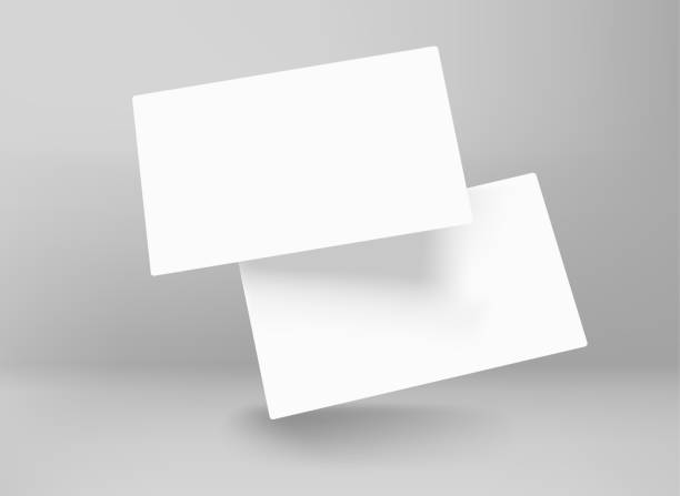 istock Two blank white business cards in perspective. 3d vector mockup for branding 1411491272