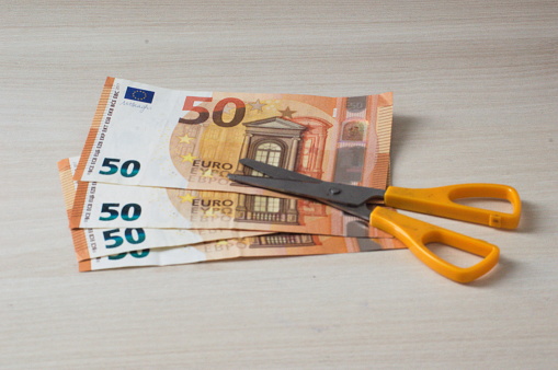 Scissors and 50 euro bills as a symbol of economic sales or crises