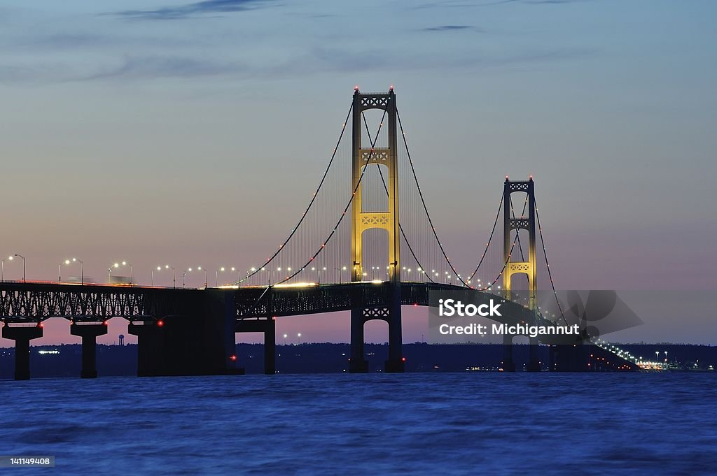 Mackinac Bridge Sunset - Mackinaw City, Michigan USA Beautiful Bridge Lights on Michigan's Mackinac Bridge, taken just after sunset. Mackinaw City Michigan, USA Mackinac Bridge Stock Photo