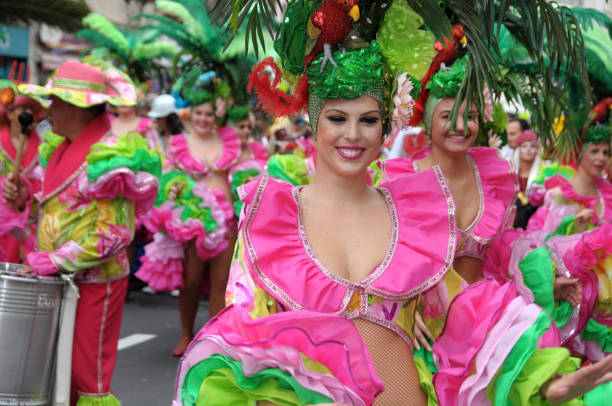 Tropical dance group in Carnival Tenerife, Canary islands, Spain - February 20, 2010: Tropical dance group in the Carnival parade of the tourist city of Puerto de la Cruz puerto de la cruz tenerife stock pictures, royalty-free photos & images