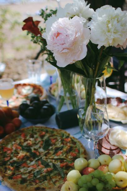 istock picnic with flowers and pizza 1411501062