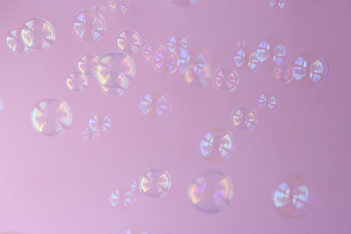 Soap Bubbles on pink background