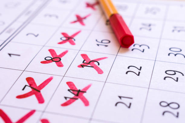 istock Red cross marked with red marker on calendar 1411512648