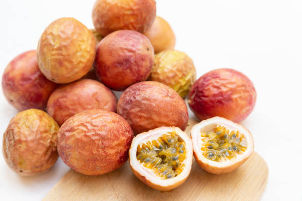 A Bunch of Passion Fruit on a White Background stock photo