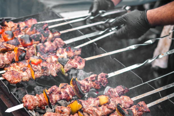 istock Cooking Caucasian barbecue (kebab, shashlik) on the grill 1411524006