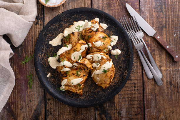 istock Roasted chicken thighs with pickle dill sauce 1411524479