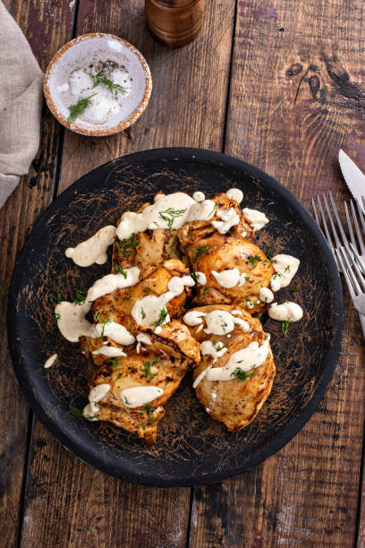 istock Roasted chicken thighs with pickle dill sauce 1411524489